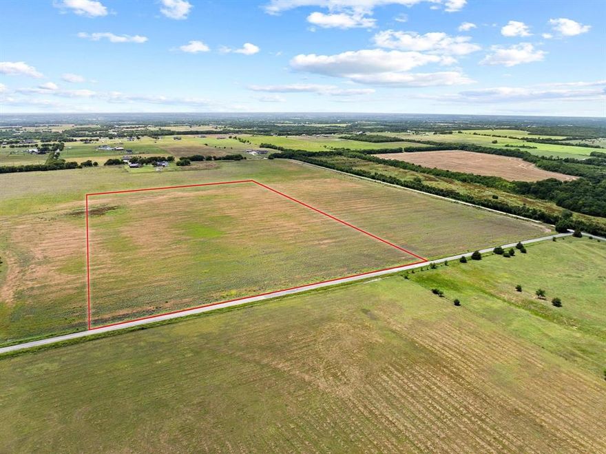 26.1 acre on paved Bucksnort Road in the highly sought-after Van Alstyne Independent School District with nearly 800 feet of road frontage. 
A 4-inch water line is currently at the road and power  is available from Grayson County Electric Cooperative. The property has no floodplain and is located outside city limits.  Bring your own builder and build you dream home, purchase an investment, or take advantage of the Grayson County regulations that allow septic on half-acre lots, creating an excellent opportunity for single-family development. The land is currently under an agricultural exemption, offering favorable tax benefits.
For larger-scale projects, additional acreage is available—up to 70.59 acres total with more than 4,200 feet of frontage.