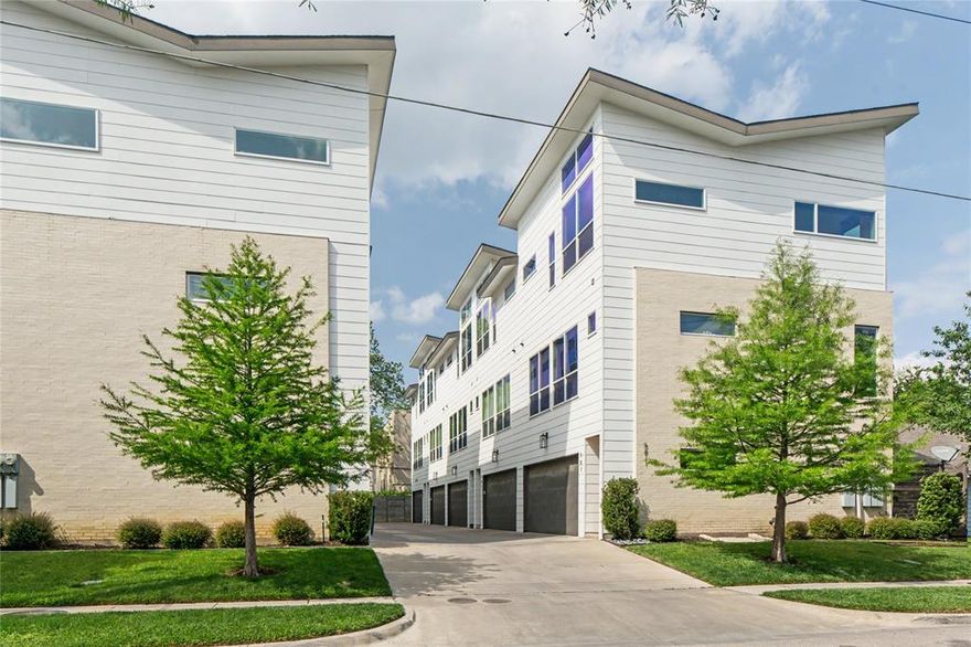 Gorgeous modern style condo conveniently located steps from Lower Greenville! Laid out over three stories, this 2017 construction home displays its quality with hardwood floors throughout, oversized windows, and soaring vaulted ceilings. The second floor boasts an open floor-plan, greeting you with a spacious living room, dining room, and well appointed kitchen featuring Bosch stainless steel appliances, ceiling-high cabinets, and soft-close drawers. The third level, with its 14' ceilings, gives way to a luxurious primary suite with a large walk-in closet. The guest bedroom currently functions as an office with ample space for a desk and murphy bed, closet and en-suite bathroom. The patio is the highlight of the house, featuring a turfed, landscaped, and partially covered hangout area perfect for hosting.