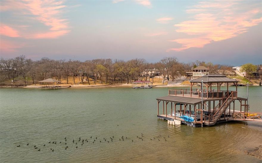 9102 Fm 1201 - Moss Lake Waterfront Retreat.  Experience the best of the lake lving on this stunning 1.46 - acre waterfront property with over 400 feet of shoreline on BEAUTIFUL Moss Lake. This 3 bedroom, 2-bath home offers the perfect blend of privacy, views and recreation. Private water well. Step outside to a true outdoor paradise featuring a two-story boat dock with two boat slips, a dedicated swim dock and an expansive upper deck- the ideal spot to unwind and take in those Moss Lake Sunsets. The property showcases a park-like setting with mature Pecan Trees, wide open green space, and breathtaking water views from your back porch.  Whether you're enjoying quite mornings with coffee or hosting family and friends for a lake weekend, this setting delivers. A unique modified Silo - adding character and functionality to this one-of-a-kind property. If you're looking for exceptional waterfront with space, views, and versatility, this Moss Lake gem is ready to welcome you home.