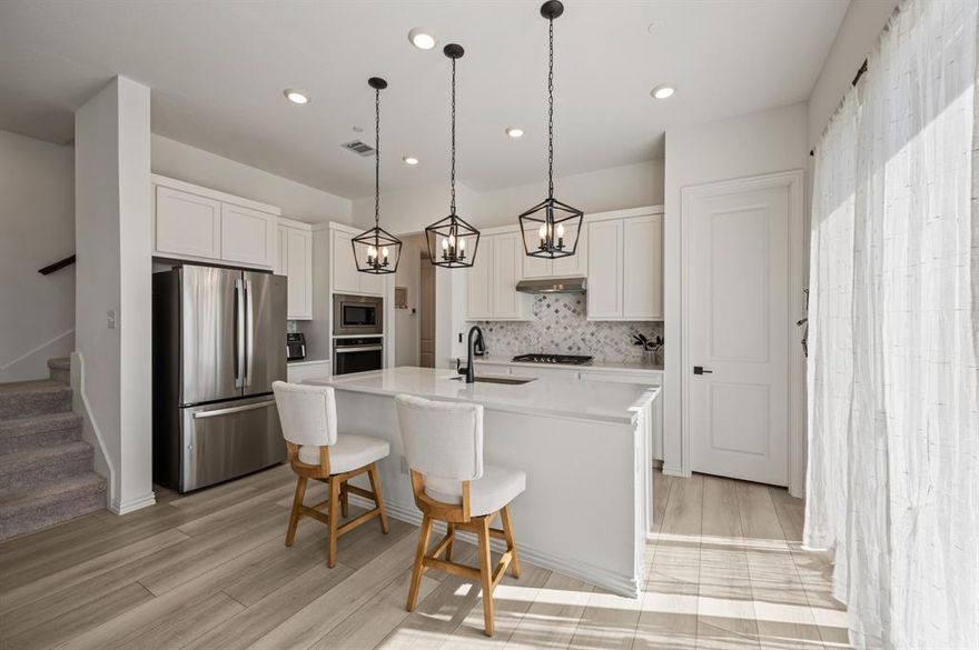 Welcome to this beautifully maintained, turnkey 2022-built home located in the Urban Trails Cottages neighborhood walking distance to a highly esteemed private high school and just blocks away from several shops and restaurants. Step inside to discover an open floor plan featuring a spacious living room filled with natural light that flows seamlessly into the eat-in kitchen. The kitchen offers generous storage with a large pantry and plenty of counter space for meal prep and entertaining. A stylish half bath with a decorative accent wall is conveniently located downstairs. Upstairs, you'll discover a versatile flex room perfect for a media room, office or play area along with the laundry room for added ease. The primary suite offers an ideal retreat with two spacious walk in closets, dual sinks and a glassed in shower. Outside, enjoy a charming concrete patio that overlooking the grassy backyard, perfect for relaxing and unwinding. Don't miss your chance to call this move-in ready home yours!