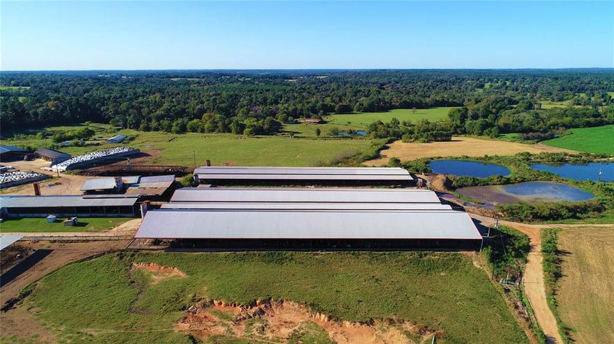 Fully operational Dairy Farm located directly east of Winnsboro, TX on 922.348 acres in Wood and Franklin Counties. This dairy farm is currently permitted for 1,475 head which can be confined and milked. Replacement heifers and dry cows can be kept of pasture. The milking (parlor) barn consists of a Double sided 30 parallel facility sufficient for milking 2,500 to 3,000 head. Dairy includes three and one-half freestall barns, covered concrete feed lane, heifer pen, hospital-maternity barn, calf barn, two commodity barns, hay building, concrete silage pits, main house, bunk house, and two hand houses.
