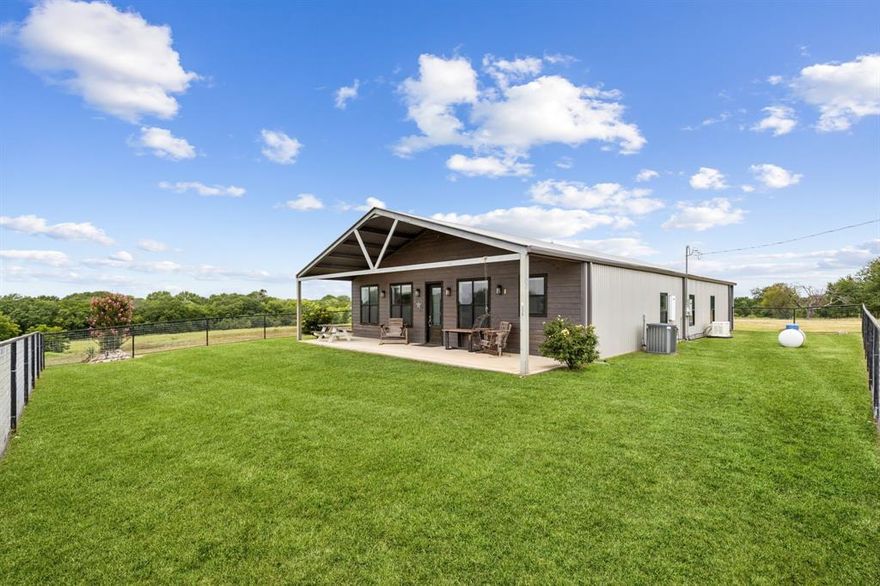 Experience the perfect blend of luxury and country charm with this stunning 2-bedroom, 2-bath barndominium set on 26.6 picturesque acres in Decatur. Designed with an open floor plan, the home offers seamless living and entertaining spaces filled with natural light and serene views of the surrounding countryside. The highlight of this property is the expansive garage and workshop — a true masterpiece for the discerning buyer. With soaring ceilings and oversized bays, it easily accommodates a tractor, multiple vehicles, or recreational equipment, while still offering dedicated space for a dream workshop. Whether for a craftsman, car enthusiast, or hobbyist, this space is as functional as it is impressive. Outdoors, the sprawling acreage invites endless possibilities — from ranching and recreation to creating your own private retreat. Every detail of this property reflects a balance of modern comfort, rustic elegance, and wide-open Texas living. This is more than a home — it’s a lifestyle.