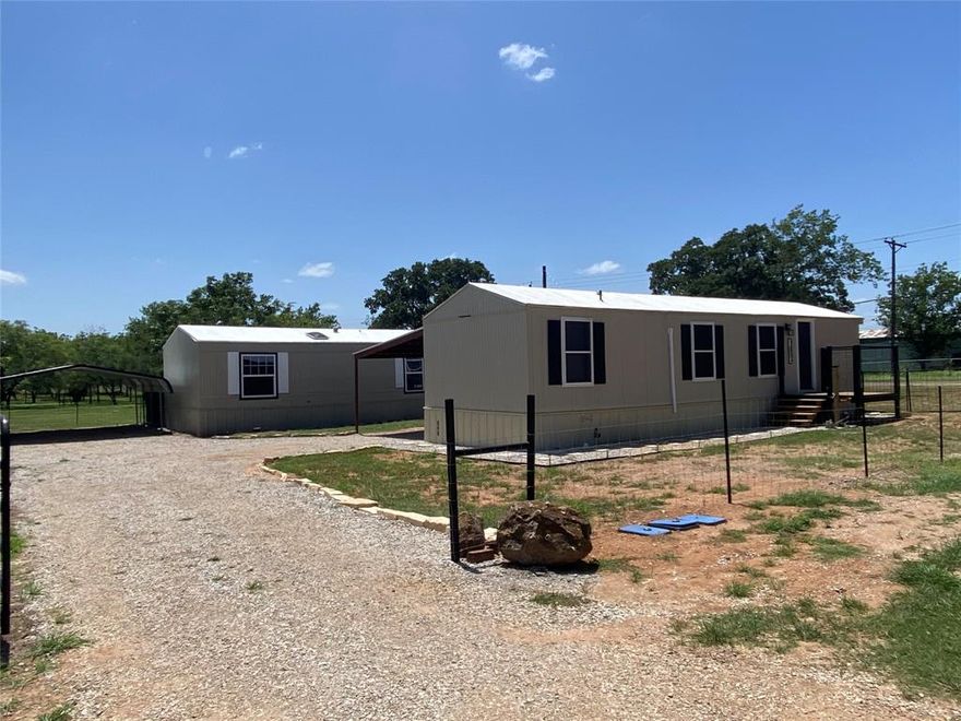 Great Investment Opportunity – Dual Home Property on Fenced Lot Totaling 1,528 Square Feet!
Don’t miss out on this incredible opportunity to own two manufactured homes on a spacious 0.27-acre lot, fully fenced and ready for your vision. Whether you're looking for a rental income property, a multi-family setup, or a live-in renovation project, this unique property has it all.

The first home is a 1998 Fleetwood, offering 628 square feet of completely remodeled living space. This 2-bedroom, 1-bath home is move-in ready or perfect for immediate rental. It features a brand new LG two & a half ton mini-split system for heating and cooling, a new electric water heater, and an all-new PEX plumbing system. The kitchen includes a refrigerator, range, built-in microwave, and dishwasher. The central heat and fan are fully operational, while the AC unit just needs some TLC.

The second home, approximately 900 square feet, is a renovation-ready project with great potential. It has newer windows, skirting already in place, and the interior has been gutted for a fresh start. Formerly a 2-bedroom, 2-bath layout, it could easily be converted into a 3-bedroom home. It comes with a new built-in stove, vent hood, and various home improvement items. Sewer and water taps are already installed and just need to be connected.

Both homes have separate 911 addresses, their own water meters, individual sewer systems, and a fresh coat of roof coating. Each property includes a carport and its own storage building. Both homes are anchored into the ground for added stability.

This property offers multiple income streams or living configurations with the flexibility to suit your needs. Live in one, finish the other, and unlock the full investment potential. Listing Agent is related to Seller.  **Buyers & Buyer's Representative to Verify Utilities, Measurements, Schools, Taxes, & All Other Information**