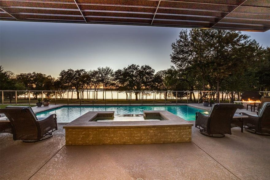 Incredible Water Views & Stunning Sunsets Along 216 Ft of Open Waterfront! Clean lines & a pallet inspired by the beauty of the landscape. Hues of Lake Lewisville create a marriage of nature & form w minimal interior design to create an open contemporary style*34 ft retractable glass doors open the Sunroom to the outdoor pool, firepit & lake, combining nature & home*Open California Modern w a Scandinavian flair, truly custom built home offers so many extras: European cabinetry, quartz countertops, wine storage& beverage refrigerators, huge central island w farm sink, enormous pantry, gas & glass crystal fireplace w cut stone floor to ceiling exterior, extensive wood-look tile throughout, barn doors & pocket doors, smooth finished walls, built-ins & storage everywhere, pool bath w shower, sauna & floor to ceiling tile, Interior Storm Shelter*Spacious Primary w seating & bath w walk thru shower & 8x25 closet*Fully Foam Encapsulated*Water Softener*32 kw Generator*Lake Pump Waters the yard
