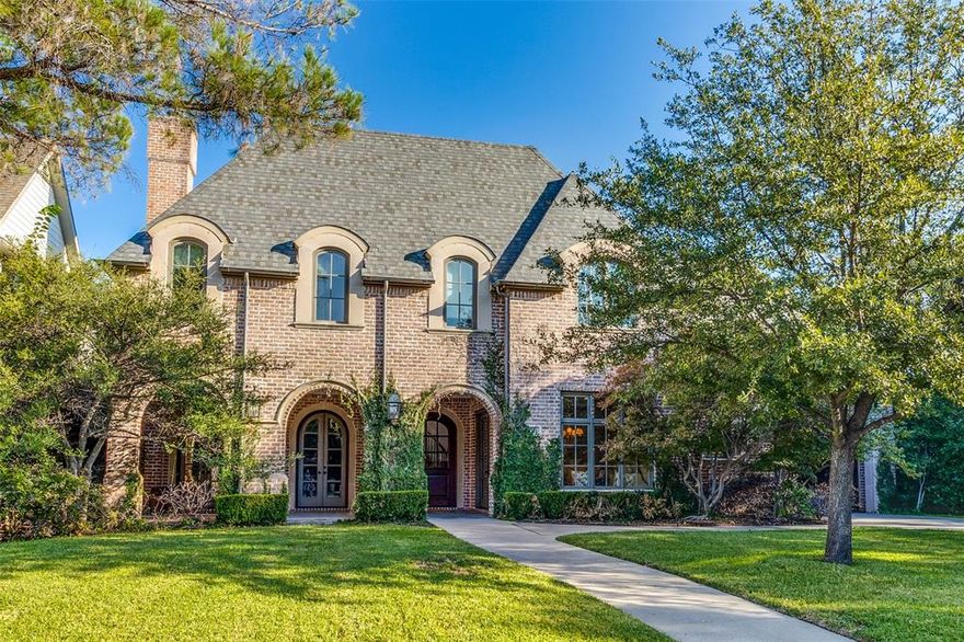 Perfectly situated on .26 acres in Preston Hollow, this light and bright home has it all including 5 bedrooms, 3 full and one half baths, and multiple covered outdoor spaces. You are welcomed into this 4,930 sq. ft.home through the large covered front porch which opens into the grand and gracious foyer leading to the private paneled study with extensive built-in's and the formal dining space. The first floor is rounded out with a beautiful eat-in chef's kitchen, wet bar, breakfast room, family room and the oversized primary suite which boasts his and her's vanities and a massive walk in closet. Outside there is a covered patio with fireplace that opens up to the expansive backyard. Upstairs there are 4 additional bedrooms, two full baths and not one, but two large bonus playrooms. A porte-cochere leads you to the attached 3 car garage. Tall ceilings, designer wallpapers, fixtures and finishes and an abundance of natural light make this home a MUST SEE! Tons of storage!