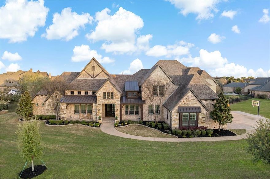 Welcome to luxury and tranquility situated on 1.6 acres in the prestigious Brooks Farm, offering an exceptional blend of indoor & outdoor living. This stunning home offers many custom features and a distinctive layout. Upon entry, a panoramic expanse of windows allows for amazing views & abundant natural light. The seamless transition from the open Kitchen and family room to the outdoor area is facilitated by a folding glass wall, enhancing the indoor & outdoor living experience.  Upgrades include handscraped wood floors, ample storage, custom lighting, Cedar wood beams, quartz counters, premium appliances,& an oversized 3 car garage. Downstairs offers a primary suite with fireplace, dual walk in closets, a bath to rival any spa, home office, guest suite, family rm, dining rm, and a media rm with wet bar. Upstairs enjoy a large game rm, 3 additional bedrms & 3 full baths. Step outside to your private oasis featuring a large pool &spa, outdoor living with fireplace and built in kitchen.