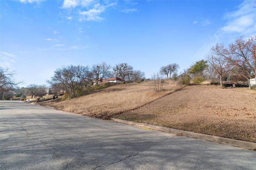This property is a large lot at 0.56-acre, providing ample room to build a custom home with outdoor features. In the quiet neighborhood of White Lake Hills, it's located at the end of a cul-de-sac in an established area and ensures privacy with minimal traffic. Enjoy access to nearby parks with walking trails, playgrounds, and pavilions for outdoor activities close to the Trinity River. White Lake Hills is just minutes from downtown Fort Worth, offering easy access to shopping, dining, and entertainment.
