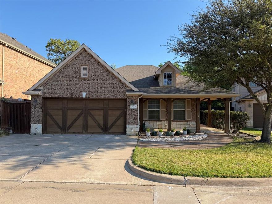 Beautiful curb appeal with large front porch and cedar garage door on a private street - 15 minutes from DFW Airport. Enjoy beauty with privacy in this former model home that overlooks a green space in the front and has a stunning backyard with retaining wall, landscaped flower beds and an iron fence that looks out over a treed creek area. Bright living space with neutral colors, designer touches and custom drapery throughout. Kitchen boasts granite counters, island, pantry and connects to a spacious dining area. Tremendous master bedroom with walk in closet and master bath with dual sinks, jetted tub and separate frameless shower.