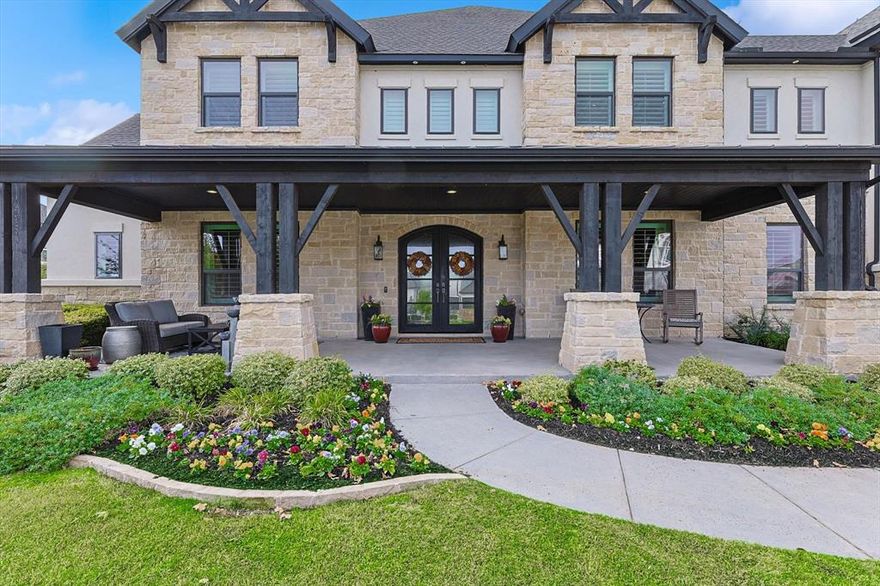 Welcome to a residence where luxury and thoughtful design meet at every turn. As you approach via the grand circular driveway, the elegant front porch and lush landscaping immediately captivate. Inside, this meticulously maintained, one-owner home exudes sophistication with custom finishes, refined upgrades, and every detail considered.Designed for effortless entertaining, the home features two 12’ sliding glass doors with electronic bug screens that create a seamless transition between the indoors and the expansive outdoor oasis. Relax in the custom-designed Claffey swimming pool featuring tanning ledge + water features complete with 12 person hot tub, outdoor kitchen, 3x7 Benswinger fireglass firepit seating area, added Equinox covered area with electricity, electronic screens allow for your outdoor living space to be transformed into a screened in porch AND priceless sunset views. Plantation shutters & custom drapes add classic elegance throughout the interior. Designer light fixtures, hardware and custom built in cabinets in the office, game room & media room completed and ready for your enjoyment. High end California Closets in 4 bedrooms and pantry. Smart living is at your fingertips with Control 4 System managing all AV equipment and Aqualink system for the pool equipment. The layout includes two bedrooms downstairs and three upstairs, each with a private en-suite bath, offering both privacy and convenience. The media room with stadium multi functional theatre seating elevates the home entertainment experience, while a heated and cooled storage room adds versatile space. Even the four-car garage has been transformed to luxury with upgraded commercial grade aluminum safety glass doors, Liftmaster Elite side mounted openers, built in elfa shelving and epoxy flooring. Custom xmas lights + wreaths are ready for the holiday season.  This home is a rare find, combining luxurious features, exceptional privacy, and an ideal setting for seamless indoor-outdoor living.