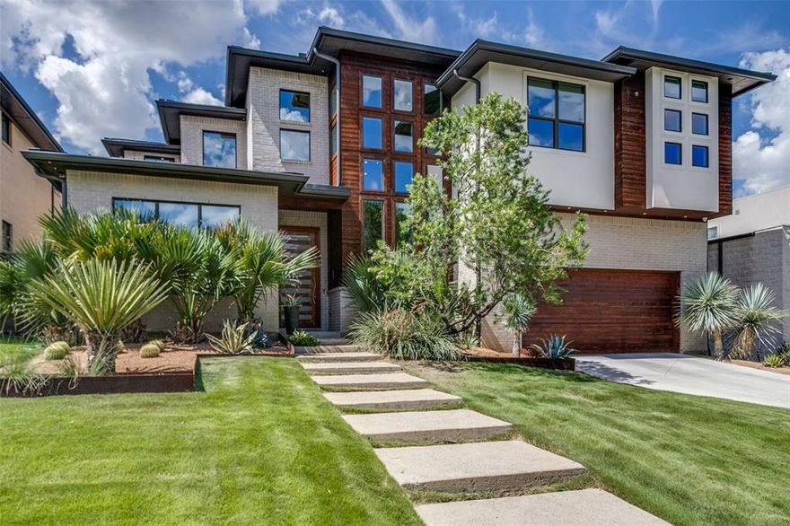 Contemporary Modern on one of Lakewood's most desired streets. Personal home of Custom Home builder Keen Homes.  Tons of natural light throughout the home, Open Floor Plan on both levels. This home has Two Primary Bedroom Suites, one on First level and one on Second Level. Study on first level, Entry with floating staircase open to second level. Chef's kitchen with Dacor appliances, gas cooktop, double ovens, wine refrig, island with sink, large walk-in pantry, Catering-Prep kitchen behind the main kitchen with abundance of storage. Electric window shades in bedrooms and main rooms. Upstairs game room with wet bar. Two Laundry room areas in home. Two sets of sliders doors opening to outdoor living area with fireplace and resort style pool area with hot tub and waterfall feature. Electric Roll down screens to protect you from the mosquitos in the outdoor space.  Turfed lawn in the backyard. Lakewood Schools. Walkable to White Rock Lake and walking trails. Don't miss this property!!