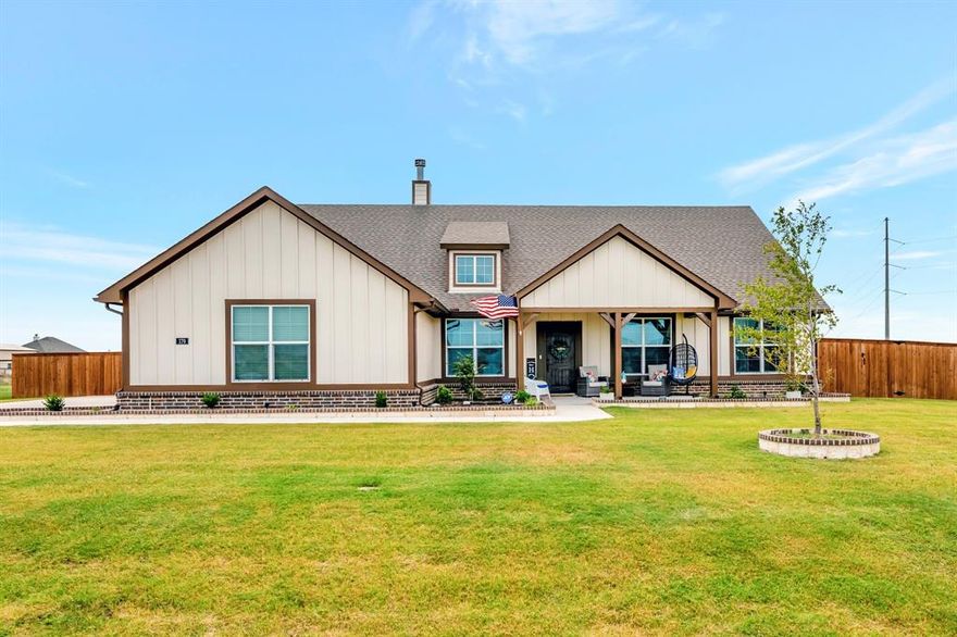 Discover the perfect blend of modern luxury and small-town charm with this stunning 4 bedroom, 3 bath home in Rhome, TX. Nestled within a new subdivision renowned for its excellent schools, this home offers an unparalleled living experience. Step inside to an expansive open concept layout bathed in natural light. The living areas seamlessly connect, making it perfect for entertaining. The kitchen features state-of-the-art appliances, granite countertops, and a spacious island. Retreat to the large master suite, complete with a luxurious en-suite bathroom featuring dual vanities and a generous walk-in closet.  The exterior is equally impressive. Enjoy evening gatherings on the large back patio or sip your morning coffee on the inviting front porch. The seller has thoughtfully added a large pergola creating a personalized outdoor oasis. This property is truly move-in ready and won't last long.