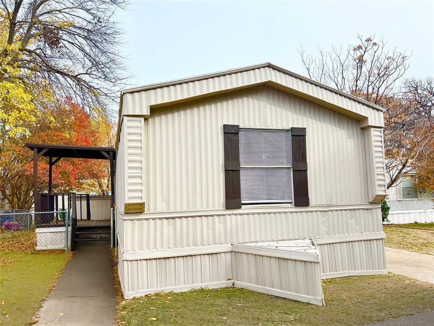 Beautifully renovated single wide mobile home located in the Friendly Village Park that is right off of 360 and Ballpark Way and close to schools and shopping. Updates include all new paint interior and exterior of the home, new carpet and laminate throughout, new lighting, new dishwasher and more! Home features spacious layout with three bedrooms and two full baths! Refrigerator is included! There is a spacious yard that is fenced that wraps around the home, and a front covered deck along with a rear entry deck from driveway from parking. Storage shed is included as well with the property. Perfect for families with kids and pets. This mobile home does not include the land but the monthly lot rent of $1050 does cover the water, sewer, and trash as well as full use of the the community pool. Bring your offers! MOTIVATED SELLER!