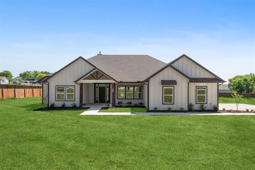 This custom four bedroom, two and a half bath home has all the bells and whistles on 1 acre! As you walk into the front entry, you'll immediately notice the high ceilings, custom light fixtures and luxury vinyl plank flooring throughout. Perfect for those with allergies, this home has no carpet! Features include a lovely dining area, spacious living room with fireplace and custom built-ins, plus a gourmet kitchen with an abundance of cabinetry, high end quartz countertops, stainless steel appliances and a beautiful picture window overlooking the backyard. The primary suite is a private oasis separated from the other bedrooms and has a spa-like bath with luxurious walk-in shower, beautiful tile work, dual sinks and walk-in closet. Secondary bedrooms are all nicely sized. Watch the Texas sunrises & sunsets from the 2 porches! Fence negotiable.