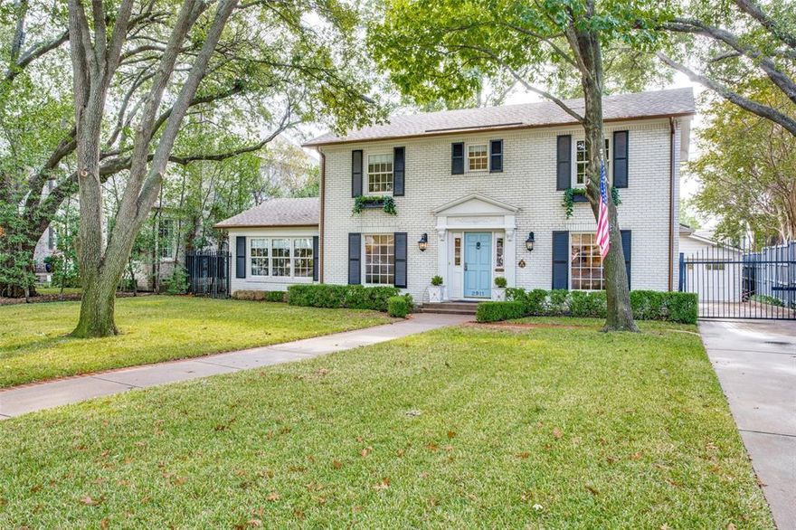 Lovely classic traditional two story with many updates on a pretty 70x160 lot. Gracious living and dining rooms off center hall plan. Downstairs also has large 2nd living room with many lovely windows as well as the primary bedroom with custom built-ins. Kitchen is beautifully remodeled with white marble and newer stainless appliances. Upstairs has 2 bedrooms and 2 baths. Nice updated quarters with new bathroom is attached to heated-cooled 4-car garage. Inviting shaded private backyard has mature trees. Updates include new HVAC 01-2022; newer copper gutters; Smith&Noble window coverings; remodeled bath upstairs.