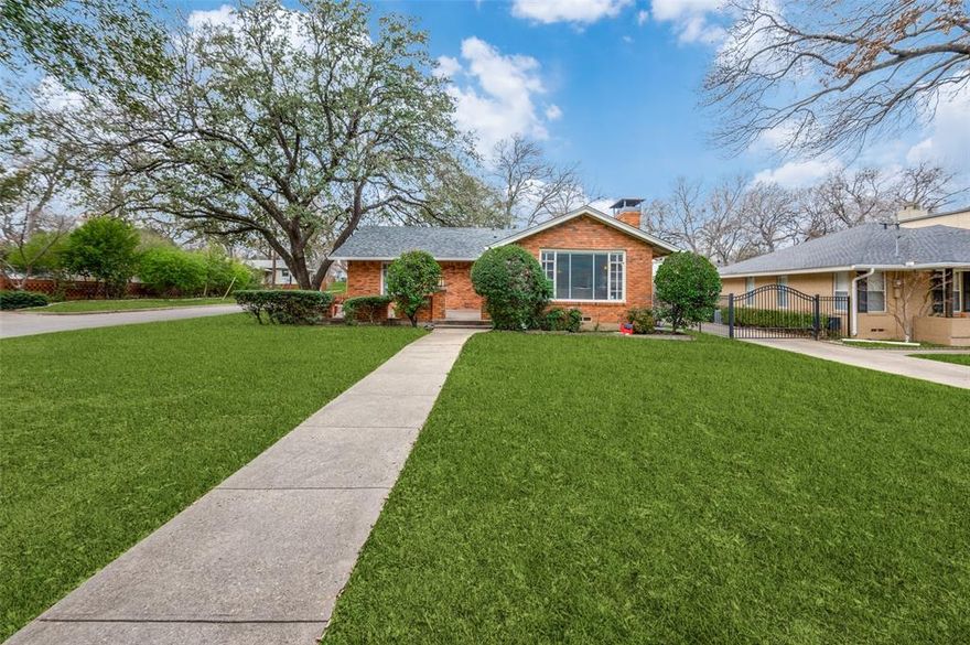 Wonderful opportunity for an updated home at a compelling price in East Kessler Park. This spacious three bedroom home with three full bathrooms offers a versatile floor plan and a rare attached garage. The huge front porch is shaded by mature trees and offers a peaceful spot to enjoy the quiet neighborhood. A spacious formal living room with fireplace, large windows, and hardwood floors continues to an open dining area adjacent to the updated kitchen with premium granite countertops and stainless appliances. A large den provides a second living space, open to kitchen with French doors to the back yard, perfect for entertaining. Downstairs are two of the bedrooms each with a full bath, including the primary suite with French doors opening out to a tranquil courtyard that could easily be transformed into a garden retreat. The split floor plan offers a tucked-away upstairs third bedroom and bathroom with tons of storage and a large walk-in closet, which can also serve as a wonderful guest suite, home office, or gym. Easy access and walkability to neighborhood restaurants and amenities (Sylvan 30, Bishop Arts, Stevens Park Golf Course, Coombs Creek Trail) as well as Downtown Dallas, the Design District, hospital district, and both Love Field and DFW airports, as well as to major roadways.  It’s the perfect balance of a peaceful retreat with all the action still at your fingertips.