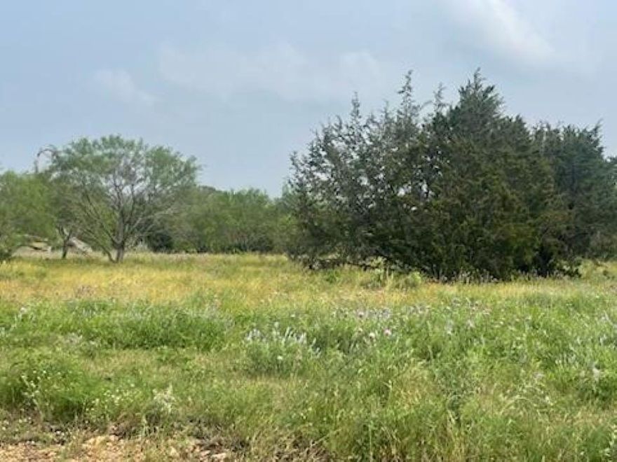 Looking to build that dream home on some land with minimal restrictions & an Agriculture Exemption already in place? Welcome home. This new community has asphalt roads, electrical poles at the street & controlled access. The entire community is fenced & a grazing lease is in effect to keep those property taxes really low. This lot offers amazing Hill Country views, gorgeous sunsets, wildlife & exotics, and native trees providing great coverage. There are minimal restrictions for building purposes. Barndominiums and Tiny Homes are allowed. Subdivision is a mere 6 miles from Lampasas and a short distance to wineries, lakes, rivers, and recreational fun for all. High speed internet is available as well. The actual physical address is Lot 175 Heartleaf Dr., Cross Timber Ranch in Burnet County.