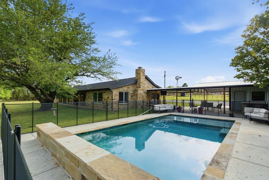 The horse friendly family retreat you've been waiting for. This newly remodeled and hard to replicate property is nearly 10 acres in Decatur and offers the perfect blend of country lifestyle, horse-friendly function, and everyday convenience--located just minutes from town and located in Decatur ISD. This beautifully updated and efficient 3 bedroom, 3 bath home is designed for both comfort and entertaining, while the outdoor setup truly sets this property apart. Enjoy a gorgeous in-ground pool, inviting outdoor living space with stone fireplace and matching bar table, shop with electricity, and a separate 1 bed, 1 bath guest apartment ideal for extended family, guests, or a private office space. There is even a working windmill with water tank storage. For horse and livestock lovers, the land is fully fenced and cross-fenced with multiple loafing sheds and traps already in place, plus great sandy loam soil and a riding area, too. There's even a perfectly flat spot ready for you to build the barn of your dreams. There is a separate equipment storage building and a gravel parking area so plenty of room for LQ horse trailers, RVs and toys. There is also a spray foamed room on the back of the windmill pasture loafing shed that makes a great saddle room, storage area or feed room. Outside city limits with an ag exemption already in place, this is a rare opportunity to own a move-in-ready small acreage property that offers both lifestyle and functionality in a highly convenient location.