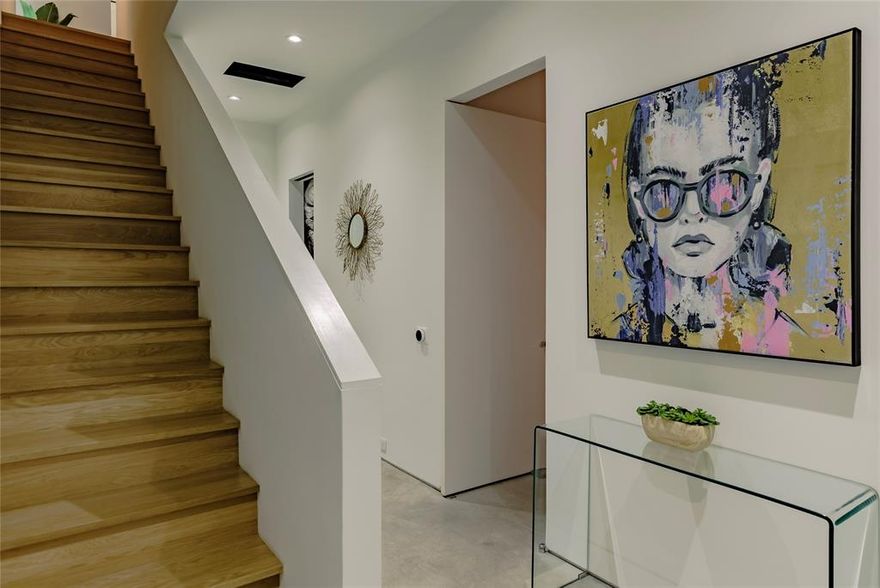 ZERO down,  NO PMI, convl loan available. This modern detached home, designed by renowned architects Far+Dang, transcends typical design topologies in this 2-story corner lot condo, featuring museum-finish walls, innovative design, and bending natural light through interior glass panels to seamlessly fill each space. Three and four-story residences are the norm in Dallas, it's rare to find a two-story walk-up, pointedly crafted with elevated touches, it truly stands apart. This corner home boasts a private yard with permeable patio, owners 2 car garage with driveway, detached non-shared walls, pivot-hinged solid-core doors, energy-efficient features, integrated surround sound, custom rolling shades, a smart home system, white oak nail down hardwood floors, soaring 10-15’ ceilings, abundance of windows providing natural light and more. The first level includes a bedroom with an en-suite bathroom and a spacious under-stairs closet. The second level features the master suite with an en-suite bathroom, laundry, large storage closet, half bath, and open living areas (including kitchen, dining and living). Outside, a 9-foot modern cedar fence encloses a generous side yard with a lighted permeable patio and pet-grade artificial turf for epic entertaining. Additional parking is available in the rear private driveway, as well as free street parking in the front. Fridge, W&D stay.