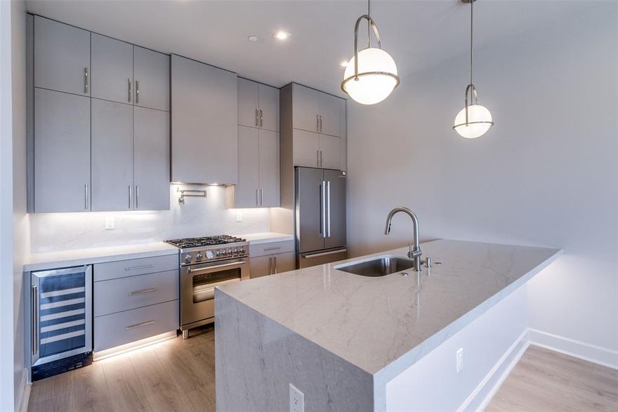*Ask about Buyer Incentives, including a 2-1 buydown with the Preferred Lender!*
 Welcome to Unit 310 at The Ruston, a newly completed new-construction residence offering panoramic Downtown Dallas skyline views and refined modern living on the edge of the city’s urban core. This exclusive condominium building sets the standard for sophisticated living, combining striking architecture with world-class amenities in the heart of the vibrant Cedars neighborhood, just minutes from premier dining, shopping, entertainment, and cultural attractions. This architectural masterpiece features 58 luxury condominium residences, each meticulously crafted with premium materials and thoughtful design Residents enjoy access to a full suite of resort-style amenities, including a community reflection pool, state-of-the-art fitness center, media room, wine room, game room, clubhouse, conference room, dog run with dog-washing station, pickleball court, putting green, and an outdoor lounge with grilling areas, ideal for entertaining or unwinding in style. Unit 310 offers 898 square feet, featuring 1 bedroom + 1.5 bathroom. The open-concept interior showcases high ceilings, designer fixtures, and upscale finishes, highlighted by a chef’s kitchen with a 6-burner Bertazzoni gas range, Bosch refrigerator, wine cooler, pot filler, under-cabinet lighting, and soft-close cabinetry. Built-in surround sound speakers, an electric fireplace, and private balcony enhance both comfort and functionality.