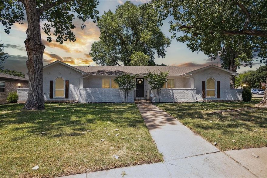 This beautifully curated brick ranch is nestled beneath mature shade trees in a walkable neighborhood with sidewalks and a peaceful Texas breeze. From the moment you step inside, you’ll feel the care and intention that went into every detail. Light pours in through large windows, highlighting soft neutral tones, layered textures, and carefully chosen finishes that give the entire home a timeless yet fresh feel.

The open-concept living and kitchen areas create the perfect space for connection whether you’re enjoying a slow morning coffee or hosting your favorite people for dinner. Chandeliers and hand-selected light fixtures bring a subtle elegance throughout, while soft hues keep the atmosphere grounded and serene.

Each bedroom is a peaceful retreat. The bathrooms continue the home’s sophisticated yet approachable design featuring updated vanities, natural finishes, and an effortless sense of calm.

Outside, a patio offers the perfect spot to unwind or entertain, with a over sized backyard surrounded by greenery and the soft rustle of leaves. Plenty of room in backyard for family gatherings and get togethers.  This home isn’t just move-in ready it’s ready to be loved.