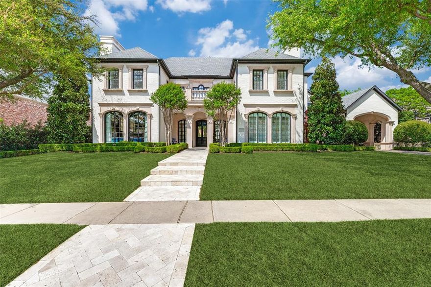Located in the guard-gated community of Starwood, this exceptional personal residence of the owner of IBB Design Fine Furnishings has been featured in national publications and television. The home showcases luxury designer finishes, extensive millwork, bespoke Gracie wallpaper and a dramatic groin vault foyer with custom wood floors and brass inlay. The chef’s kitchen features a custom ILVE range, steam oven, 12-ft island, and butler’s pantry with EuroCave wine refrigeration. Light-filled living spaces include two walk-in wet bars and 8 fireplaces throughout. The primary suite offers barreled ceilings, fireplace, designer lighting, and backyard views, with a spa-like bath, soaking tub, walk-in shower, and dual closets. A paneled study, guest suite, and additional living spaces complete the home. Upstairs includes 3 ensuite bedrooms, game room, media room with kitchenette, exercise room with sauna, additional laundry, and custom bunkroom. The private backyard features a European-inspired setting with lush landscaping, resort-style pool and spa by Aquaterra, covered veranda, fireplace, and outdoor kitchen with Lynx appliances. Ideally located near The Star, dining, and shopping.