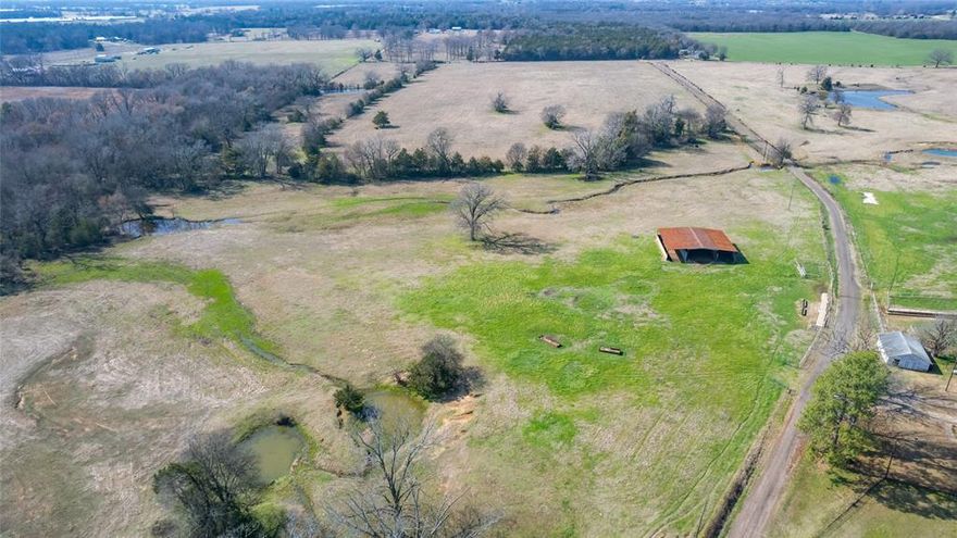 Located on a quite country road and being part of a larger tract, this 53.37 acre ag exempt tract has multi-opportunities. It could be a great place for a future home and small ranch, recreation, weekend getaway, investment or possible sub-division with road on two sides with over 4500' of county road frontage. There is a large hay barn and some steel catch pens currently in place. A small stock pond and Coon Creek crosses the property for plenty of surface water. Also native trees provide some character and shade for livestock and wildlife along the creek and back boundary. This is also in the sought after Como-Pickton CISD and only a few miles from I30, Sulphur Springs, Mount Vernon and Lake Cypress Springs. Utility providers - Wood County Electric and Cypress Springs SUD for water. New survey.