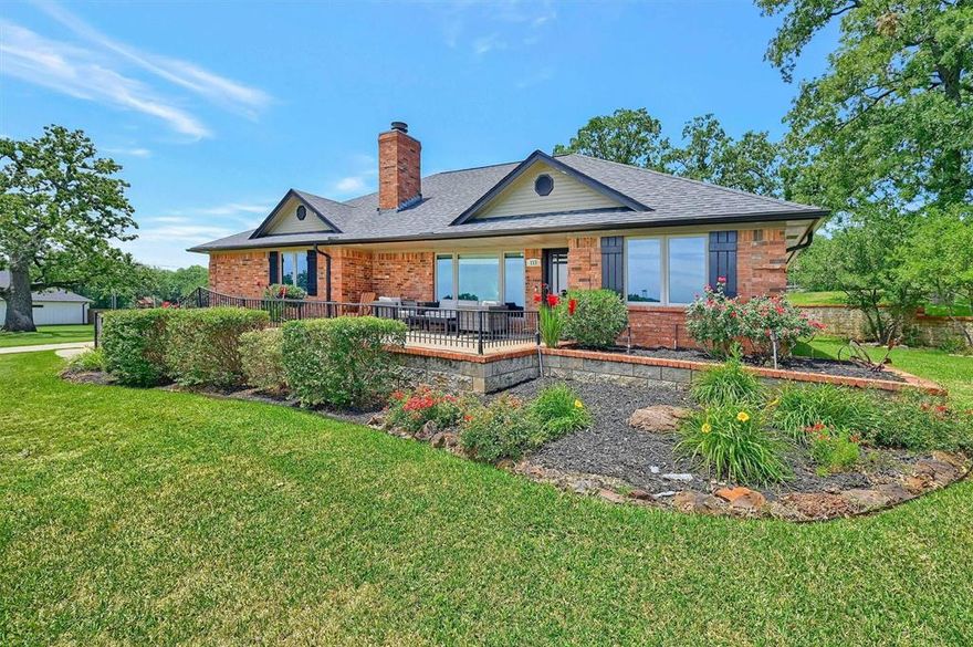 Rare Lakeview Gem on Nearly an Acre! This property is one of only a very few within Lake Kiowa offering panoramic lake views on a nearly one acre, double lot.  Situated just inside the main entrance gate and across from the community's largest boat launch, this beautifully landscaped home is move-in ready! The home has an open concept layout with wood look ceramic tile throughout.  Enjoy fabulous lake views from the spacious living area, complete with a stone fireplace, crown molding, and a sleek modern ceiling fan. The kitchen boasts a large granite topped island with seating, loads of storage, a built-in microwave, extra-deep drawers, and a large skylight that fills the space with natural light. A shiplap accent wall ties together the kitchen and dining areas. Double doors leading to the backyard and back patio area also brighten up the space. A large and stylish laundry room provides additional storage space. Don't miss the extra space around the corner in one of the TWO walk in closets in the primary bedroom's en suite bath.  Two additional guest bedrooms and a nicely appointed guest bath round out the living space of this property.  The attached 2 car garage is oversized and opens to the side of the home. A separate, detached golf cart garage provides additional storage space as well.  The expansive lawn and yard are a fantastic spot for picnics, playing or maybe a future pool! And imagine watching the July 4th fireworks launch from the dam across the street. So much fun to be had! Lake Kiowa is a wonderful community with many social clubs and activities for all ages. Don't forget the private lake, two beaches, clubhouse, unlimited golfing (included in POA dues) and coming soon a Par 3 course!