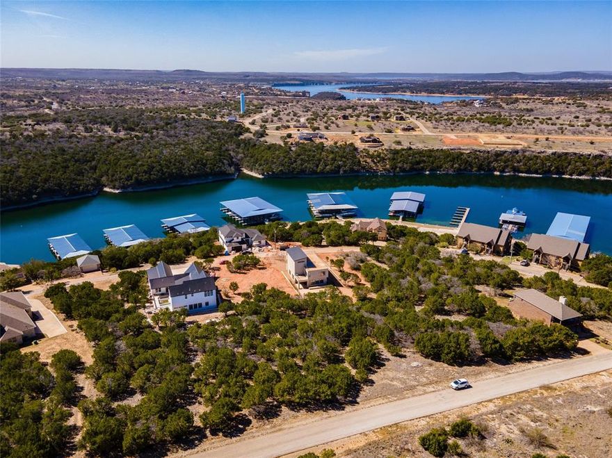 Freedom and tranquility. When you look at this lot, the words freedom and tranquility come to mind. Walking distance to The Cliffs marina, boat launch, park, and designated lake swim area. Just one street off the main drive, you get ease of access to all of The Cliffs many amenities. With ownership, you can also take advantage of 2 community swimming pools, club house, fitness center, 36 rounds of golf annually on Texas's Championship Golf Course, the restaurant, and much much more. This is a gated and guarded community, so call a local agent to get access and tour this incredible community.