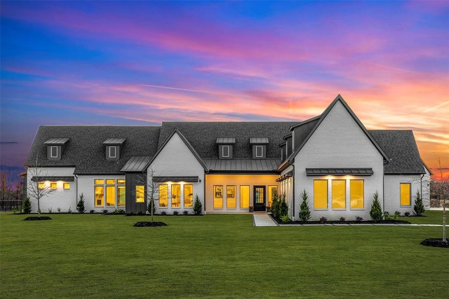 Nestled in sought-after Lovejoy ISD, this new custom SINGLE STORY haven sits on a sprawling 1.5-acre lot, and has a warm contemporary design. An abundance of natural light cascades through expansive windows, illuminating the open concept living areas and the stylish finishes. Seamlessly connected, the kitchen, dining, and living rooms, adorned with a 22ft cathedral ceiling, present a spectacular view across the expansive covered patio. Kitchen is equipped with a Thermador SS appliance package, w integrated WiFi-enabled refrigerator and freezer, microwave, double oven, dishwasher, and gas cooktop. The kitchen island is a social chef's delight, comfortably seating 7 to 8. The calming primary suite has a coffee bar area and direct access to the patio. The Ozark blue flagstone enhances the outdoor living, with a built-in SS grill and  granite prep area. The 1.5 acre lot is a blank canvas, design the pool of your dreams. Epoxy Garage, 2x6 framing, foam insulation.