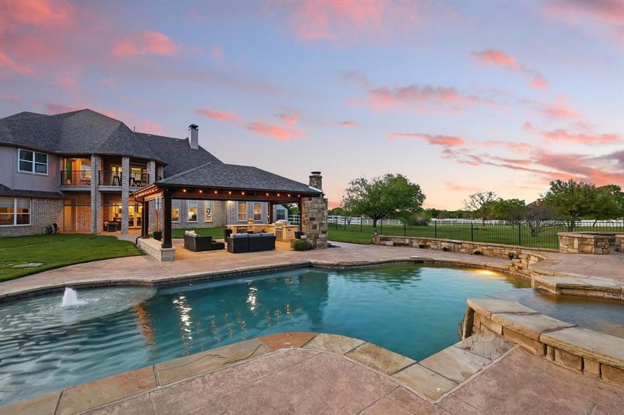 5 MINUTE DRIVE TO LIBERTY CHRISTIAN!!!!!!  

Privacy. Luxury. Land. Pool. Generator. Argyle ISD. LOW taxes.

This one-of-a-kind luxury estate checks boxes most buyers only dream about—and then goes ten steps further. Perfectly positioned on 2.5 pristine acres in an exclusive equestrian community and zoned to the top-rated Argyle schools, this home offers the ultimate blend of peaceful country charm and high-end living.

No rear neighbors behind you. No traffic. Only two homes on the cul-de-sac.

Let that sink in—unmatched privacy and quiet you can’t fake.

Inside, you’ll find 5 bedrooms and 4.5 bathrooms, including a serene primary suite + a guest suite downstairs, a private study, and a remodeled kitchen that looks like it was pulled from the pages of Architectural Digest. The modern organic finishes feel warm, on-trend, and timeless.

Now step outside:

The backyard is a masterpiece—custom pool, fire pit, and a huge covered cabana with fireplace set the stage for unforgettable nights. Phantom screens on the patio and balcony let you enjoy the outdoors year-round, and the well water keeps your lush landscaping vibrant without a single irrigation bill.

But that’s not all:

Whole-house generator = peace of mind, no matter the weather

Oversized 4-car garage + extra parking pad

Second-lowest tax rate in the Argyle ISD

Gorgeous, low-maintenance xeriscaping in the front

This isn’t just another luxury home—it’s a rare opportunity to own a truly special property in a location that rarely sees homes like this hit the market. Whether you’re entertaining on a grand scale or soaking in the peace of your private paradise, this home delivers what others only promise.

Homes like this don’t last—especially when no one else has it.

Come see it. Enjoy the sunset. Feel it. Fall in love with it.
