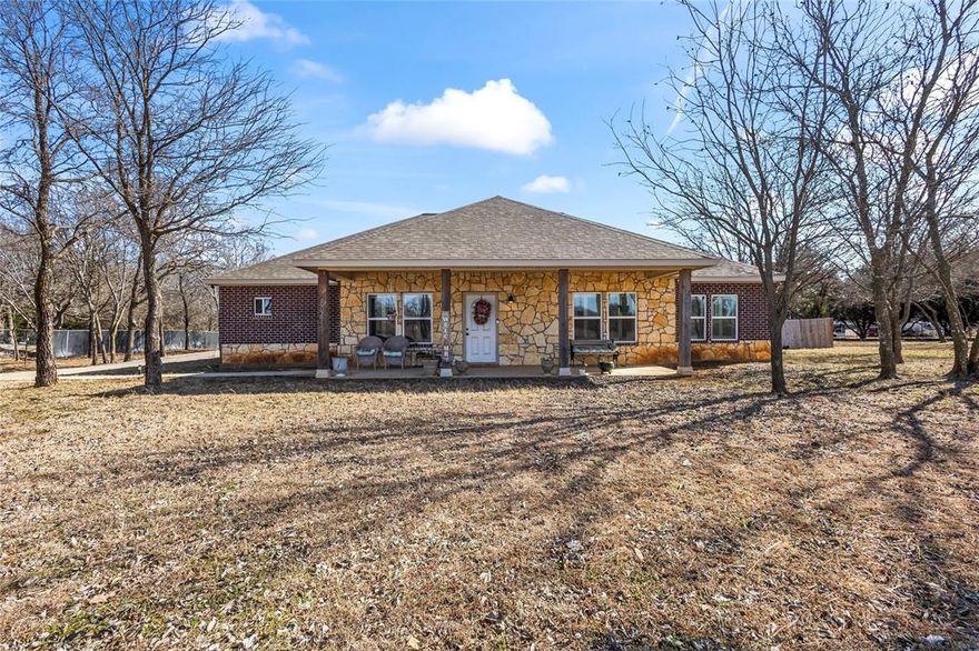 Situated on a corner lot just over an acre, this home offers a spacious front yard, a fenced backyard, and a storage shed for added convenience. A welcoming rocking chair front porch leads into an entry foyer and an open layout enhanced by wood floors and plantation blinds throughout. The kitchen features marble countertops, a large island with breakfast bar seating, and a pantry, making it both functional and inviting. The primary bedroom is generously sized with an ensuite bath that includes dual separate sinks and a frameless glass shower, while the secondary bedrooms offer ample space and flexibility. Located within the desirable Rio Vista school district, this property blends comfort, space, and everyday practicality.