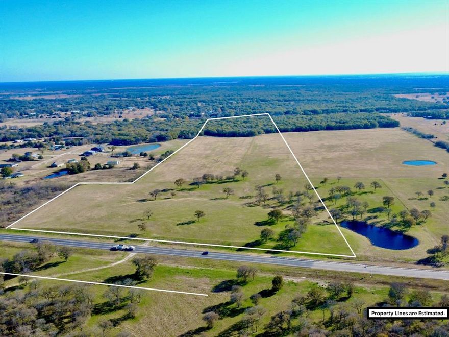 Just over 70 acres, located just west of Corsicana, immediately outside the city limits on the HWY 31 Loop Bypass. Offering an excellent development opportunity. This tract offers over 900 feet of road frontage on the HWY 31 LOOP. It can be sold with additional available adjoining acreage as well. Positioned at the highly trafficked SH 31 Corsicana Bypass, this property benefits from exceptional exposure in a rapidly growing, high-traffic area. With tremendous potential for future development, this tract is ideal for investors or those looking to capitalize on expanding infrastructure. More acreage available MLS # 21134183, 21134270, 21134262, 21134269. Property will have deed restrictions including no dumping, junkyards, hog farms, or manufactured homes. ACCESS, UTILITY AVAILABILITY AND COST SHOULD BE VERIFIED BY BUYER. EXACT ACREAGE AND ROAD FRONTAGE TO BE VERIFIED BY SURVEY, MLS LISTING STATES ESTIMATED SIZE.