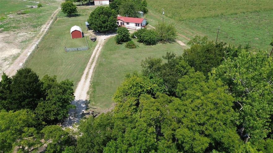 Escape the hustle and bustle to this peaceful country retreat on 1.49 acres in Farmersville. This beautifully updated doublewide home offers 3 bedrooms and 2 full baths with a spacious, open layout that makes everyday living a breeze. The bright kitchen features an island, breakfast bar, and plenty of storage, while the living room is warm and welcoming with a wood-burning fireplace. The primary suite includes a walk-in closet, jetted tub, and separate shower for your own private retreat. Outdoors, you’ll enjoy a large deck, covered patio in the backyard, storm shelter for safety and plenty of room to spread out. With accessible features like a ramped entry and accessible bath, this property is designed to welcome everyone. The metal roof, central heat and air, and wood-burning fireplace make this home comfortable year-round. Located in Bland ISD, with easy access to Hwy 380 and just minutes to downtown Farmersville, this home is a rare find for those wanting space, privacy, and modern comfort in the country. This home WILL NOT go FHA or USDA.