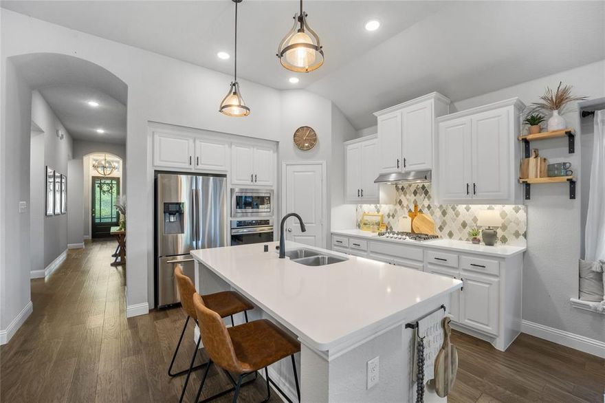 Wow!! Located in sought-after Trinity Falls. Over 1700 sqft of pure delight. You will feel as though you’ve walked into a model home. The open living room with open concept kitchen, over-sized island that is made for entertaining. Private owner’s suite complete with spa bath. This home is about creative spaces – a hidden bar and private desk area complete with barn door. Don’t miss the cozy backyard with extended deck and covered patio. This is a must see!