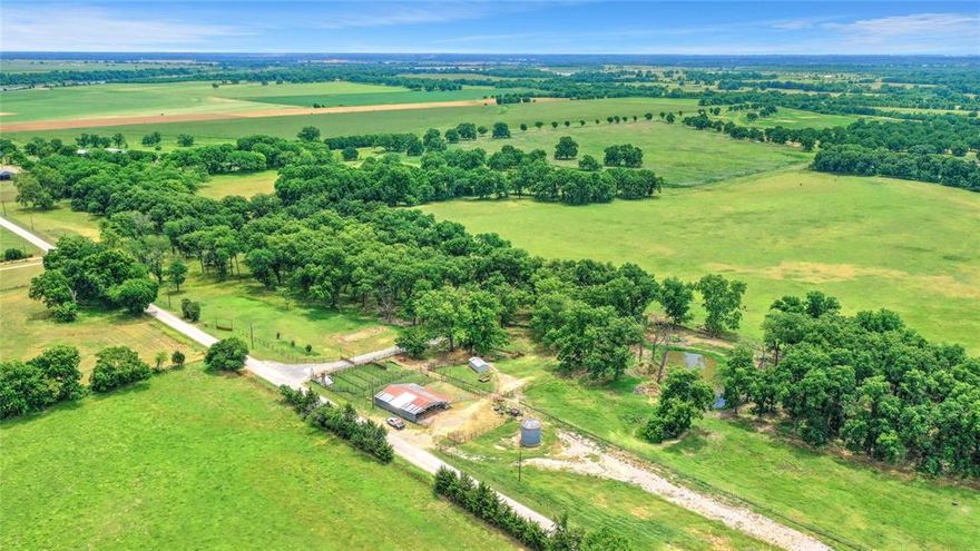 a beautiful 360 ac ranch located in NE Grayson Co. close Red River. Ranch is a short drive from Denison or Bells. The ranch has been used for stockers and what pasture in the past some sprigging in Coastal has been done also, lots of beautiful pecan trees, 2 creeks, and some of the most productive land in the area. There is a set of corrals and holding pens at the headquarters along with equipment shed. The north boundary of the ranch has frontage on Elmore Rd and Carpenters Bluff runs along the east side. The ranch is cross fenced and lots of recent fences. The soils are Okay, Bastrop, Redlake and Elbon. Smith Creek crosses the ranch in the southern portion  and Choctaw Creek forms the south boundary. All types of wildlife can bee seen on the ranch. One of the few larger tracts of land on the market today.