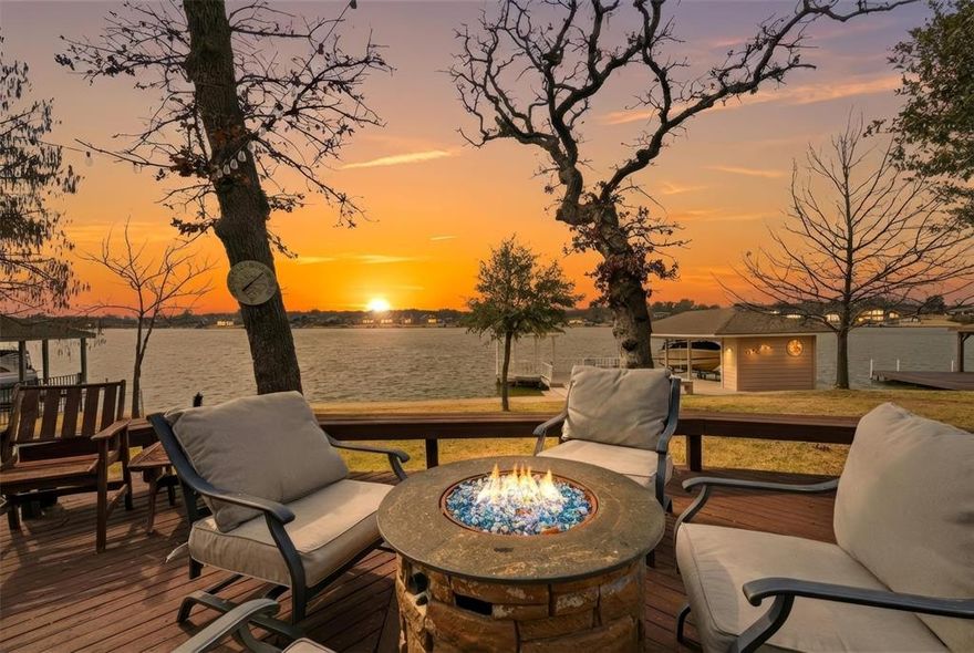 Looking for a standout lake property? This Blackfoot peninsula home delivers big water views, generous space, and a layout built for hosting. Tucked near the end of one of Lake Kiowa’s most desirable streets, the setting offers privacy and incredible scenery.

The entry opens to a spacious living area with a wall of windows overlooking the lake, gas fireplace, and multiple seating options. The adjoining dining room flows into an oversized kitchen featuring double ovens, built-in refrigerator, wine fridge, ice maker, prep sink, and extensive cabinetry and counter space—ideal for entertaining.

The main-level primary suite is a true retreat with lake views, gas fireplace, built-ins, room for a sitting area, and a large ensuite bath with jetted tub, dual vanities with seated makeup space, and an expansive walk-in closet with built-in dressers and cedar closet. The closet connects directly to the laundry room for convenience.

A second primary suite downstairs is perfect for guests. Upstairs you’ll find three additional oversized bedrooms, all with walk-in closets. One has a private bath, while the other two share a full bath with easy access to the upstairs living area or game room.

Storage and hobby space are exceptional with an oversized three-car garage with half bath, plus a separate 17' x 21' golf cart garage and workshop.

Outdoor living is just as impressive. A covered front porch connects to a wraparound deck leading to the back patio with fire pit, hot tub, and surround sound, and a path to the updated dock. The dock features Trex decking, boat lift, manual jet ski lift, storage closet, and a gazebo for shaded seating and lake views.

Lake Kiowa is a gated lake and golf community featuring a private lake, an acclaimed 18-hole course and 9-hole par three course with unlimited golf for property owners, and resort-style amenities including beaches, parks, a restaurant, pro shop, and round-the-clock security.