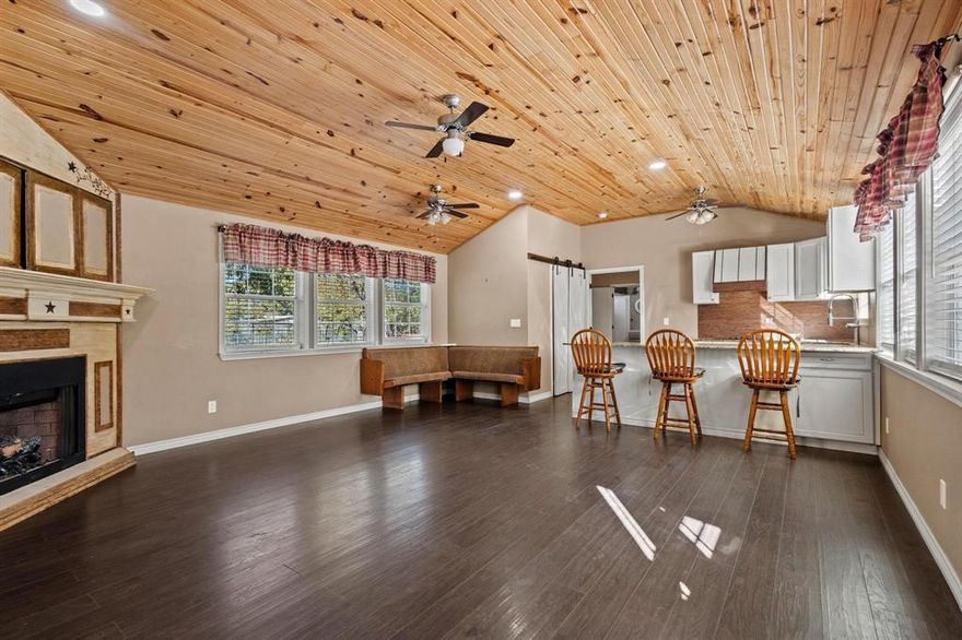 Adorable 2-Bedroom Cottage on a Spacious Half-Acre Lot
Tucked away at the end of Reich St in town, this charming 2-bed, 1.5-bath tiny home offers cozy living with thoughtful updates throughout. Enjoy warm wood floors, stunning wood-paneled ceilings, and a bright open layout that feels larger than expected. The kitchen features granite countertops, ample pantry space, and modern touches. Outside, you’ll find a detached carport, storage shed, and a large tree-shaded yard—perfect for relaxing, gardening, or entertaining. A peaceful in-town retreat with plenty of character and room to breathe!