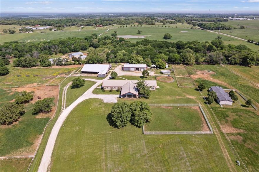 Discover the incredible opportunity this almost 18 acres AG EXEMPT working Ranch has to offer in Pilot Point Texas. Starting with the Cinderblock Show Barn with 14 stalls - 4 larger, 15x20 and 10, 12x14 stalls with Nelson electric water and built-in stall grazer hay feeders in every stall, two tack-feed rooms, wash rack, half bath, and washer & dryer hookup. Wonderful office with kitchenette space, two private offices and half bath. You'll also find an Equipment-hay shaving metal shed with a 1 bedroom apartment with 1 living room, full kitchen and bath. 43x23 breeding barn with storage, 2 stocks, breeding dummy and lab. Open air pipe barn with 30 stalls with option to be 16. Possibility to build 150x250 Arena and possible hilltop homesite to build a custom dream home with pad already in place. Convenient 3 bedroom, 2 bath mobile home with a living room and kitchen. Pipe and pipe cable fencing and round pen. Option to purchase neighboring 11 acres provides endless opportunities truly make this your dream Ranch!