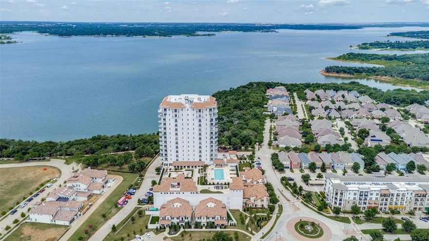 If you dream of living in a home with breathtaking views, it can be realized at Lakeside Tower. Welcome to this elegant 7th-floor residence offering beautiful views of Grapevine Lake. This 2-bedroom, 2-bath condo with over 2,300 square feet features a dedicated office, formal dining room, spacious living room with a stunning fireplace, and a private elevator entry for the ultimate in comfort and privacy. The gourmet kitchen is equipped with Wolf gas range with 6 burners, a Sub-Zero refrigerator, custom cabinetry, and an oversized island—perfect for everyday living and entertaining. The primary suite offers direct access to the large, covered balcony, where you can enjoy peaceful mornings or evening sunsets with serene lake views. Relax in the spa-inspired bath with an oversized vanity with two sinks, a walk-in shower, soaking tub, linen closet, and a generous walk-in closet. Lakeside Tower offers an exceptional blend of lakefront elegance, high-end finishes, and amenities that rival a five-star resort. Enjoy 24-hour concierge services, a resort-style pool and hot tub, fire pits, putting green, an outdoor kitchen, and grilling stations. Or relax inside at the spa, Yoga and Pilates studio, Golfzon golf simulator, movie room, billiards lounge, wine room with private dining, and clubroom with whisky bar. Additional conveniences include guest suites, a dog park, car wash, valet service, and secure parking. Ideally located in the walkable Lakeside community near upscale dining, boutique shopping, scenic trails, and just minutes from the DFW Airport. This is truly lock-and-leave luxury at its finest.