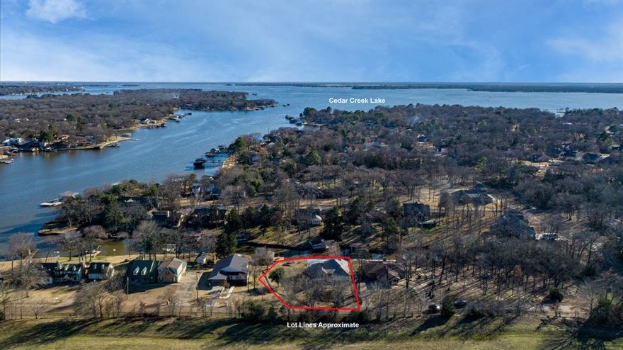 Discover serene lakefront living in this charming 3 bed, 2 bath home. Boasting over 2100 square foot interior, this updated house offers spacious comfort of a modern open-plan living & dining area with a custom kitchen and a large dine in counter, high ceilings and lots of windows to enjoy the stunning outside views. The primary bedroom features a private retreat, vaulted ceiling, garden tub, dual vanities and walk in shower. Step outside to enjoy your own personal oasis with a waterfront boat dock, swim platform and stone fire pit perfect for leisurely days or entertaining guests. Nestled in the peaceful community of Enchanted Oaks, enjoy a tranquil lifestyle with a generous outdoor space, a composite deck and a substantial lot. Embrace a life where every day feels like a vacation!