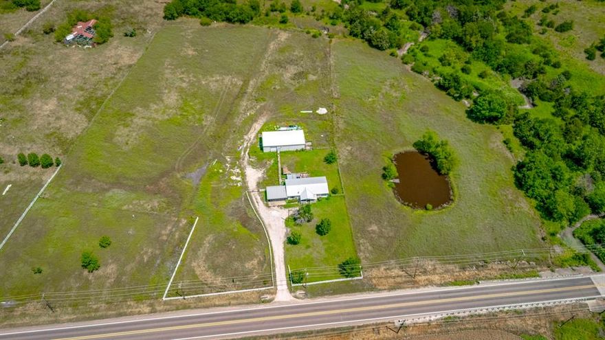 Discover an exceptional investment opportunity on 5.5 acres along Hwy 66, featuring 494 feet of prime highway frontage and an average daily traffic count of 10,000+ vehicles. The property includes an 1880 square foot metal building, mobile home which could be used for office, and a pond adding extra value and versatility. Although currently zoned agricultural, it offers significant commercial zoning potential—ideal for retail, office, or mixed-use development. With its high-visibility location, this land promises maximum exposure for any business venture. Don't miss your chance to secure this versatile piece of property with limitless potential.