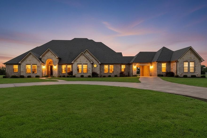 Welcome to your dream home in the prestigious gated community, Fairway Parks, where country charm meets refined elegance. This stunning custom-built residence sits on over an acre of beautifully landscaped grounds, greeting you with a circular driveway and undeniable curb appeal. Step inside to discover soaring ceilings adorned with beautiful crown molding and an open-concept living, dining, and kitchen area designed for both comfort and effortless entertaining. The huge living room showcases a gorgeous stone fireplace, abundant windows flooding the space with natural light, and custom built-ins. The chef's kitchen is a culinary enthusiast's paradise, featuring tons of cabinetry, expansive counter space, a massive island, walk-in pantry, and sleek black stainless appliances.
The primary suite is nothing short of spectacular, boasting a beautiful fireplace, marble countertops, generous cabinet storage, two enormous closets, a jetted tub, and oversized walk-in tile shower. Two additional bedrooms on the main level each feature their own ensuite bathrooms, while two more bedrooms await upstairs. A versatile media room and a well-appointed office with built-ins and closet complete the main floor.
Perhaps the most distinctive feature is the fully independent guest quarters, connected to the main home by a charming porte-cochère. This self-contained space includes its own entrance, a living and dining area, full kitchen, bedroom with walk-in closet, bathroom with walk-in shower, and dedicated laundry area. This area offers true independence for guests or extended family.
Outside, a large back porch with another stunning stone fireplace creates the perfect setting for relaxing evenings under the Texas sky. Practical perks include spray foam insulation, a post-tension foundation, full-size laundry room, and no city taxes.
This pristine move-in-ready home truly must be seen to be appreciated. Schedule your private showing today.