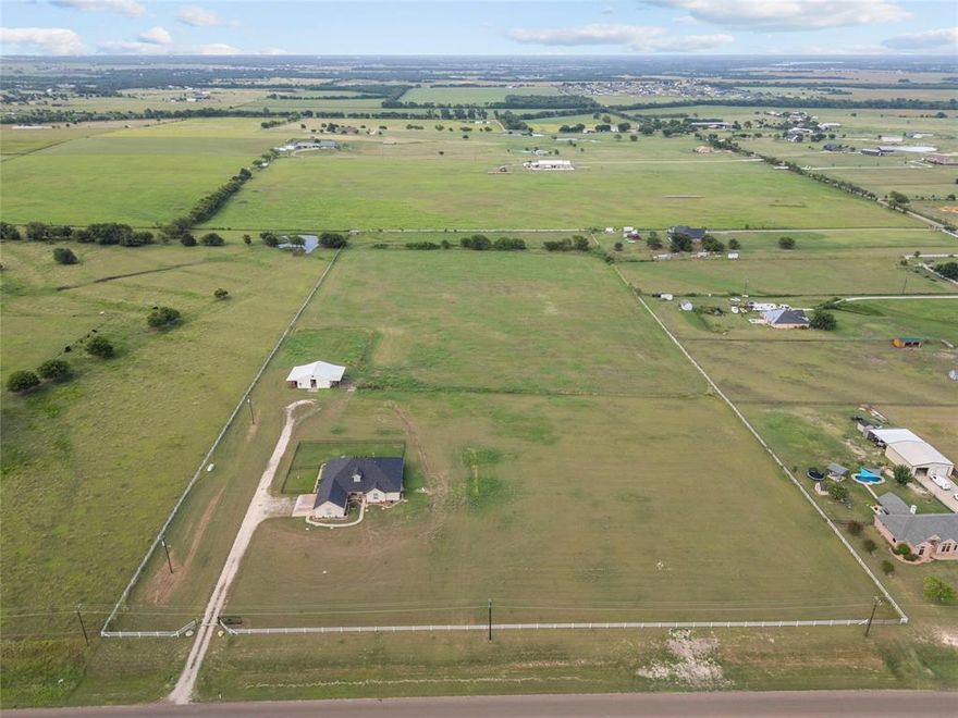 Looking for land where you can keep horses, cows, or goats? This 7.5-acre property offers the space and freedom for livestock and peaceful country living. Located in the county in Waxahachie ISD with NO HOA, just light deed restrictions. Approximately 160 feet of road frontage and over 1,200 feet in depth, there's plenty of room for a custom home, barn, pasture, and more. Utilities are available at the road—just purchase the meters to get started. The area is restricted to residential use only, with site-built homes required to be a minimum of 1,800 square feet and constructed with at least 80% masonry materials. There's no time limit to begin construction, giving you flexibility to build when you're ready. This area is on septic, with water provided by Buena Vista SUD and electricity through Hilco Electric Cooperative. Don’t miss this opportunity to create your ideal rural lifestyle! Can also be purchased as only 2.5 acres or as much as 10 acres. House on 5 acres next door is also available for purchase, 3810 Greathouse Road.
