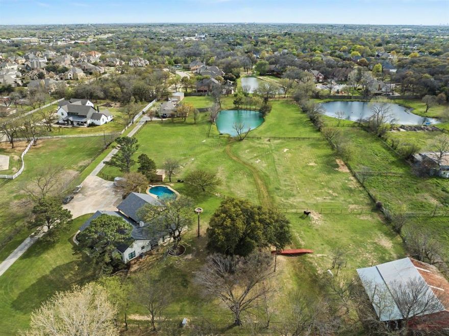 Nestled in the heart of Southlake, this rare 4.5-acre property offers the perfect blend of city convenience and peaceful country living. The beautifully property offers a renovated 2,305 sq. ft. home features 3 spacious bedrooms and 4 full bathrooms, designed with modern finishes and comfortable living in mind.  Property could be subdivided into multiple lots.  

Scenic pond, and open pasture ideal for horses or livestock. Equestrian enthusiasts will appreciate the well-appointed 4-stall barn, providing both functionality and charm. Mature trees surround the property, offering privacy, shade, and a picturesque setting year-round.

Whether you're seeking a private retreat, hobby farm, or luxury acreage estate, this property delivers unmatched versatility in a prime location just minutes from shopping, dining, and Open Enrollment into Carroll ISD top-rated schools.

All information deemed accurate, to be verified by Buyer and Buyer's Agent including all schools and measurements.