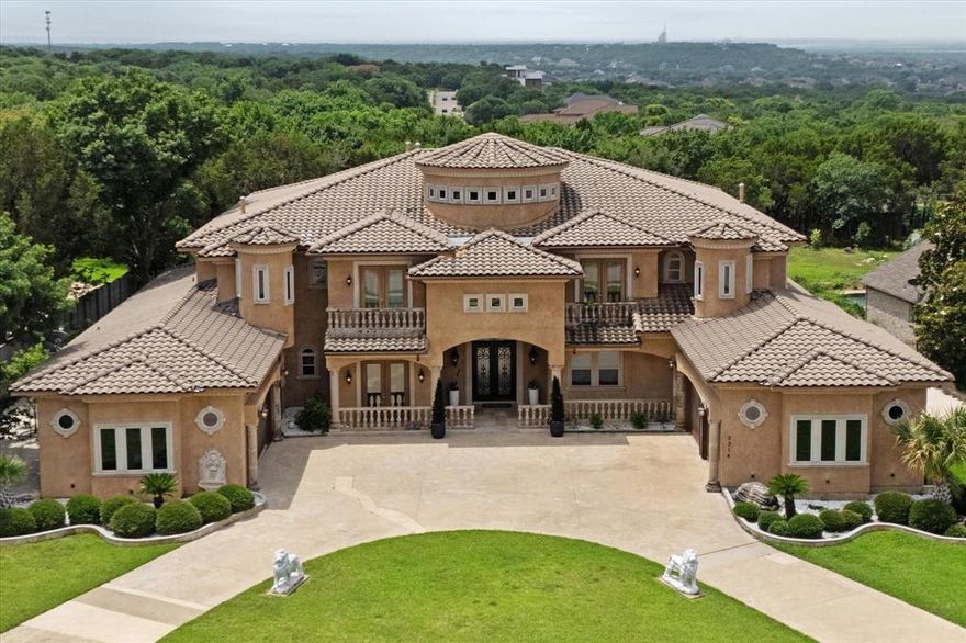 Nestled within the gated Hills of Lake Ridge in Cedar Hill, this spectacular Mediterranean estate offers over 7,600 square feet of refined luxury, elegance, and architectural grandeur. Set on a beautifully landscaped acre, this home is designed for those who appreciate timeless beauty and modern comfort.  From the moment you enter the grand foyer—anchored by a sweeping double staircase—you’re greeted by soaring ceilings, intricate millwork, and rich, ornate details throughout. The home boasts of two oversized primary bedroom suites and four additional spacious bedrooms, with their own private bathrooms, providing ample space for multi-generational living or luxurious guest accommodations. The first floor features several living areas, great for receiving guests and entertaining and has several stunning fireplaces that add warmth and sophistication.   The home office is located near the primpary suite and overlooks the backyard - giving you a private & serene place to work when working from home. Many modern touches have been added to this home, giving it a fresh classic vibe, making this a place you will never want to leave!  This home has several patio areas, seamlessly blending indoor and outdoor living. Upstairs, a breathtaking terrace spans the back of the estate, offering panoramic views and a perfect setting for sunset gatherings, as well a large media room for movie night with the family. The lush backyard includes a designated concrete pad, pre-plumbed for water and electricity, ideal for a future casita, a show-stopping outdoor kitchen, or a live music setup for unforgettable garden parties. Car enthusiasts will appreciate the 4-car garage with custom epoxied floors, and the circular drive adds an extra touch of grandeur. Located just minutes from Joe Pool Lake and Tangle Ridge Golf Course, this estate combines serenity with accessibility.

This is more than a home—it’s a destination.