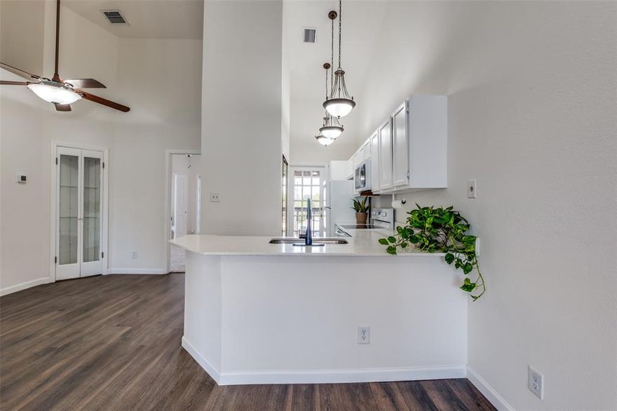 This Peaceful two-bedroom, two-bath Home in the Sought-After Bluffview location is Ready for Turn Key Living! Near Lovers and Inwood, this Condo is currently the Only One on the market in the five building complex with Vaulted Ceilings and on the Third floor. NEW HVAC and Offering a Large Living Area, this Open Floor Plan provides a Chic and Practical Home in the heart of Dallas' top restaurants and shopping. Private and Gated, this Condo Community has a Pool and Cabana, Fitness Room and Clubhouse. The home features Luxury Vinyl Plank flooring throughout, Carpeted bedrooms. Dining area decorated with Built-In Bookshelves and Glass Front Double Door Storage. The Large Primary Suite offers a peaceful retreat with its own Private Balcony, walk in closet with shelving, and an Ensuite bath with New Mirror. The Second Bedroom is ideal as a Guest Room or Office. A Second Balcony off kitchen with Extra Outdoor Space, New Turf added recently- Perfect Sitting Space for your morning coffee! Additional Storage Closets. Buyer and Buyer Agent to Verify All Information is Correct.