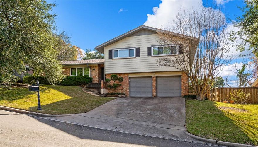 Offering so much for so little, this immaculate four bedroom, three bathroom split-level home is as appealing as it is affordable!   -----   With a magnificent split-level floorplan rooted in a mid-century aesthetic, the spacious 2,763 square foot layout superbly accommodates all needs across its three living spaces and two dining areas.   -----   Upon entry to the primary level, a formal foyer, living room, and dining room great entrants.  Sequestered from the home's den and kitchen, this layout affords ample seating arrangements but can be opened to create a single, massive, open living space.  With a fireplace neatly tucked in a corner and the cozy sunroom protruding out from the living room, this floorplan utility and flexibility is unmatched, even at homes twice the size!   -----   On the other size of the home, half staircases lead to the home's four bedrooms and three bathrooms.  Travelling up reveals a primary suite with walk-in closets (super rare for a home of this era), loads of central storage, and two guest rooms with an easily accessed hallway bathroom.  Downstairs, a private suite and second hallway bathroom work well as a guest suite or even an office retreat!   -----   Outside, the terraced yard benefits from two distinct levels, mature trees, a large patio, and even an owl's nest!  As a bonus, the garage features a large workshop in addition to two car accommodation.   -----   Centrally located in Waco's Mountainveiw neighborhood that's just a short walk to schools and the park, this might be THE best value to hit the market today.  To see for yourself and appreciate just how spotless this home is, please call or text to schedule your appointment today!