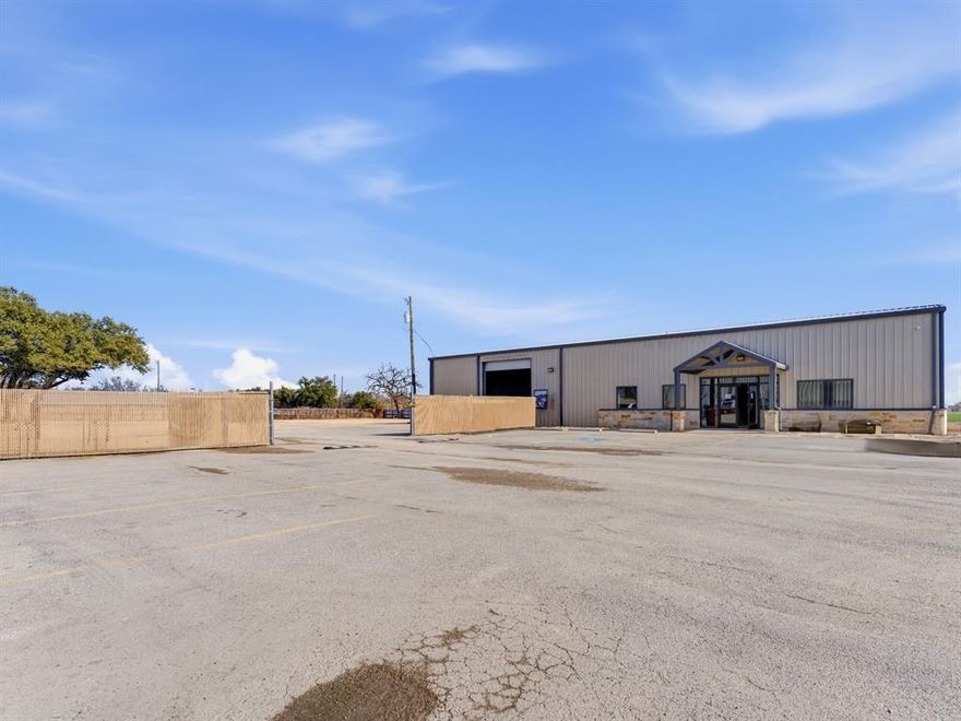 Prime commercial opportunity in a high-traffic location on S. Graham Ave in Stephenville. This 5,000 square foot building offers a functional layout with approximately 2,500 square feet of air-conditioned showroom space and 2,500 square feet of shop space, making it well-suited for retail, service, automotive, contractor operations, or a variety of other business uses. The front showroom provides a clean, climate-controlled environment ideal for customer-facing operations, display, or office use. The adjoining shop area offers ample room for equipment, storage, fabrication, or service work. The site features a fully fenced yard, providing security and flexibility for outdoor storage or additional operational space. Hard surface parking ensures easy access for customers, employees, and deliveries. Positioned with excellent visibility and strong exposure along one of Stephenville’s main thoroughfares, this property offers convenient access and a location that supports long-term business growth. An excellent opportunity to establish or expand your operation in a well-traveled commercial corridor.