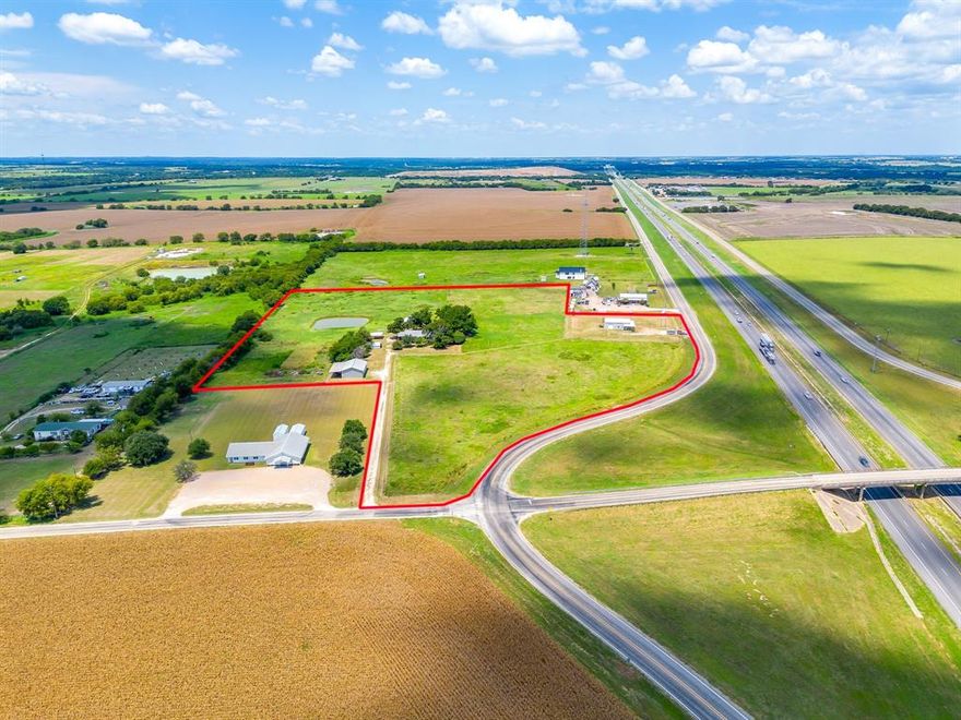 Prime Residential & Commercial Opportunity – 15.61 Acres on High-Traffic Corner Located between Alvarado and Grandview, just minutes south of Fort Worth off I-35, this rare and versatile property sits on a prominent corner by an overpass with a service road running in both directions for exceptional visibility and access. Comprising four parcels totaling 15.61 acres, the property includes 3.36 vacant acres ready for development, 1 acre with a small warehouse-storefront ideal for retail, office, or light industrial use, a charming farmhouse with 5 bedrooms and 2 baths in need of some TLC with rental or renovation potential, nearly 11 acres for future expansion or recreational use, and multiple metal shops for additional storage. With its prime location, multiple access points, and mixed-use potential, this property is a must-see for investors, business owners, and developers ready to bring their vision—whether commercial, residential, or a combination of both—to life. Ag exempt.