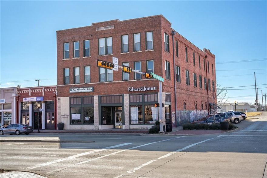 This iconic multi-tenant office building, located in the heart of historic downtown Terrell, was originally built in 1892 as the Brin Opera House. Extensively restored in the late 1980s, the building blends timeless architectural charm with modern functionality and has been meticulously maintained since its renovation. The third floor, once the opera house, has been converted into office suites, with the original dome and restored chandeliers still intact, offering a unique and inspiring workspace. The building is also located within a designated Opportunity Zone, providing potential tax incentives for qualifying businesses and investors. This historic property provides a rare opportunity to work in a beautifully preserved setting, with easy access to local shops, restaurants, and services in the vibrant downtown area.